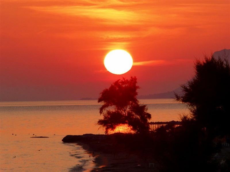 Sunrise over Agia Marina bay